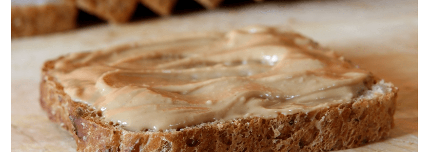 Peanut butter with brown bread.